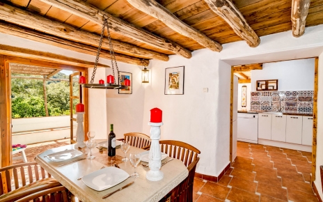 Dining room has doors opening to terraces